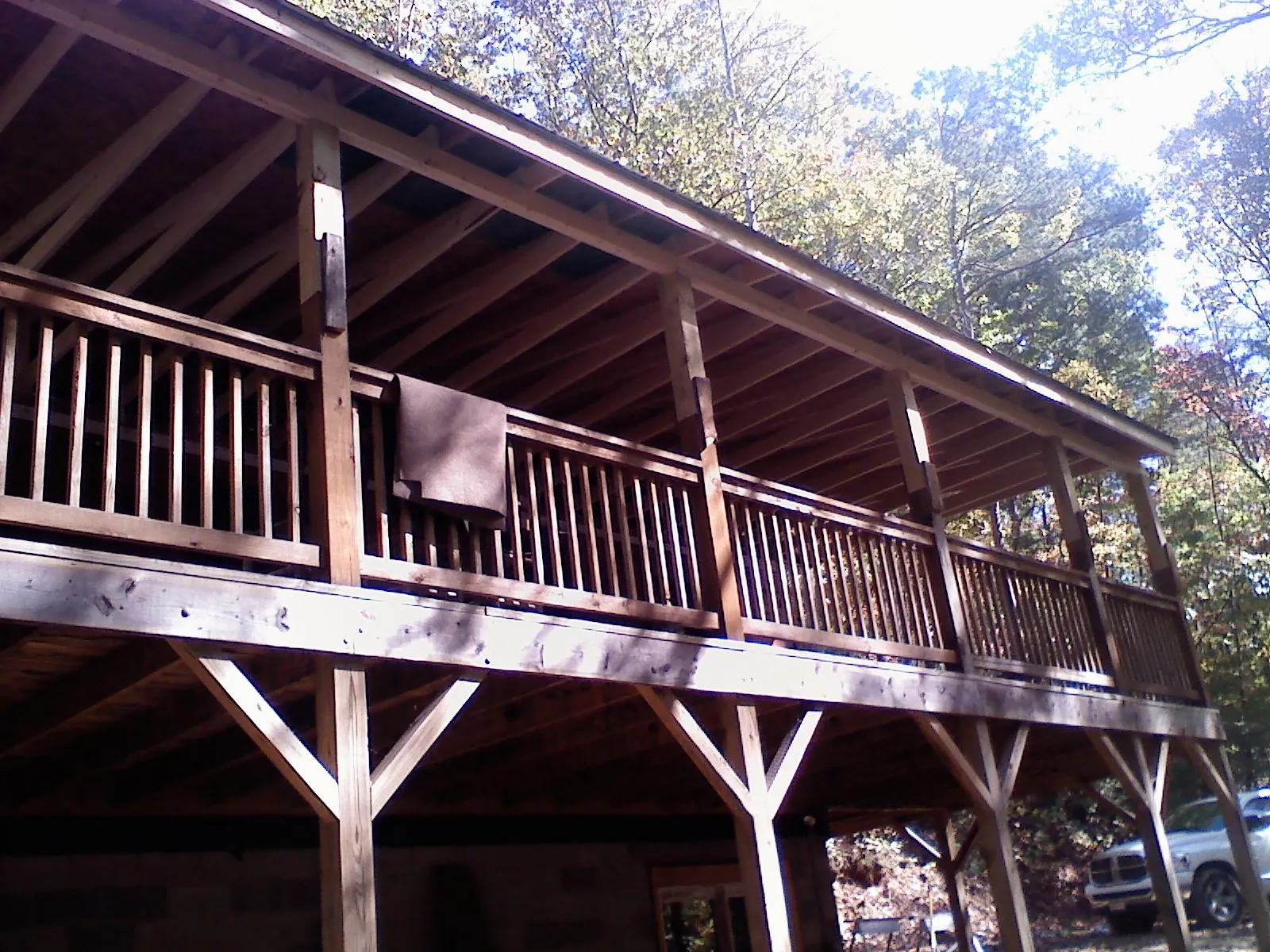 Timber framing under a new elevated porch and deck — Roof Leak Repair in Great River by Roofing Brothers
